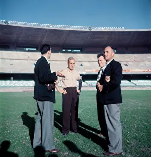 01174 Prints: England captain Billy Wright inspects the pitch at the newly opened Maracana Stadium in
