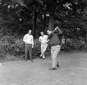 00442 Prints: England cricketer Bobby Simpson enjoys a game of golf at Morton Golf Club watched by