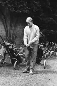 England footballer Bobby Charlton chosses his club as enjoys a round of golf during an