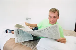 England footballer David Platt seen here reading the Wall Street Journal at the team base