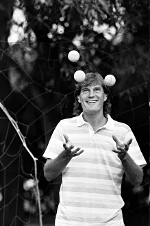 Tricks Prints: England footballer Glenn Hoddle juggling tennis balls as the team relaxes at their base