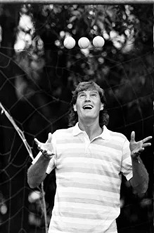 England footballer Glenn Hoddle juggling tennis balls as the team relaxes at their base