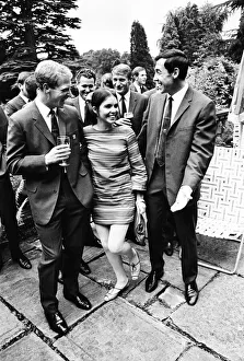 00795 Prints: England footballer Gordon Banks reacts after giving a kiss to actress Vivienne Ventura