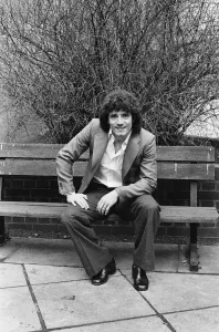 England footballer Kevin Keegan poses for photographers as he performs a joke for them