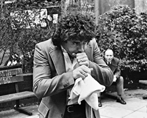 01052 Prints: England footballer Kevin Keegan poses for photographers as he performs a joke for them