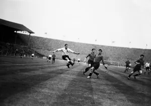 England footballer Nat Lofthouse rockets his first goal past Belgium defenders Carre