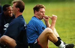 00302 Prints: England footballer Paul Gascoigne joking and sucking his thumb as he sits back to back