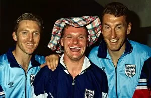 00302 Collection: England footballer Paul Gascoigne wearing a tartan hat poses with teammates Gary Stevens