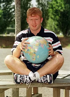 00271 Prints: England footballer Paul Scholes point out Romania on Globe