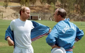 England manager Alf Ramsey talks with Bobby Charlton during a training session with