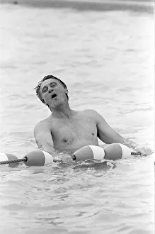 Relaxation Prints: England manager Bobby Robson relaxing in the swimming pool at the Cima Club in Monterrey