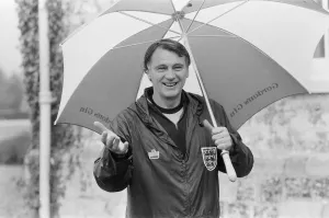 Tracksuit Prints: England manager Bobby Robson underneath an umbrella during an England training session