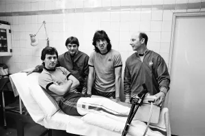 England player sat the treatment table - skipper Bryan Robson gets the attention of Fred