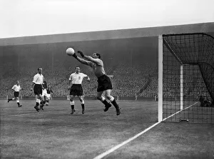 00469 Prints: Englands goalkeeper Gilbert Merrick (right) saves from Budai (not show