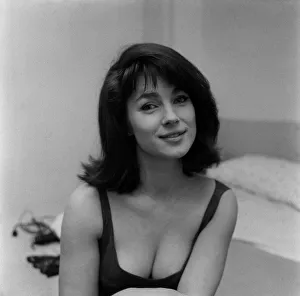 English actress Shirley Anne Field wearing a low ciut black dress