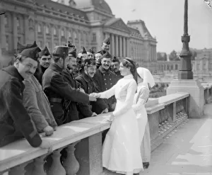 English nurses seen here meeting Belgian soldiers outside the Royal Palace before