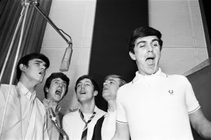 The English pop rock group, Dave Clark Five singing in a recording studio