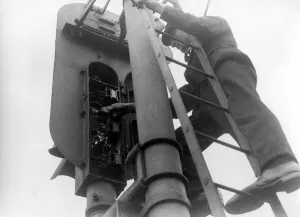 English Railways, attending to signal lights on the Southern Railways. c