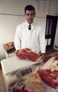 English referee jack Taylor weighing a joint of meat in his job as a butcher May
