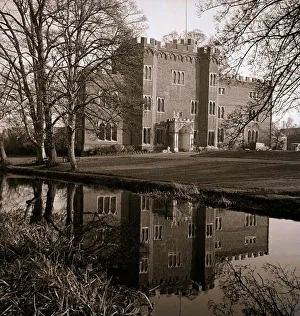 Lake Prints: An english stately home reflected in the stream outside architecture england water