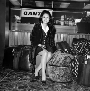 Entertainment. Film actors. Michael Caine left Heathrow with his Phillapino girl friend