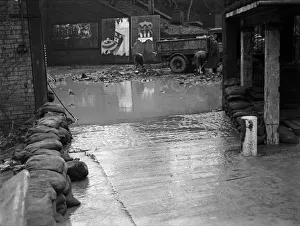 The entrance to the Cadbury factory at Bournville as workmen clean up after flooding