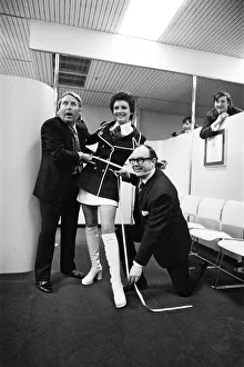 Eric Morecambe and Ernie Wise, accompanied by Miss Great Britain Carolyn Moore