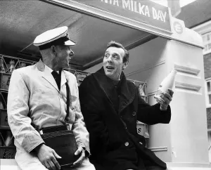 Occupation M Prints: Eric Sykes Comedy Actor Comedian being shown by his milkman Harry Smith how its done