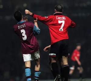 Erica Cantona of Manchester United pushes away West Hams Julian Dicks during the match