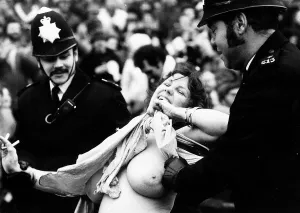 Erica Roe Streaker at International Rugby game at Twickenham, escorted by police