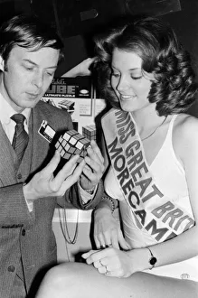 01099 Prints: Erno Rubik, Hungarian inventor of the Rubiks Cube with Miss Great Britain