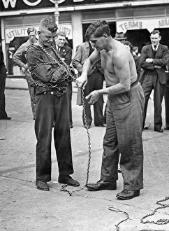 Bull Ring Prints: Escapologist demonstrating their skills in the Birmingham Bull Ring, West Midlands
