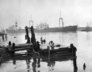 Tugs Prints: The Esso tanker Appalachee seen here being coaxed by tugs into the Manchester Ship