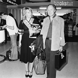 00435 Prints: Esther Rantzen and Television producer Desmond Wilcox at Heathrow Airport 27th June 1977