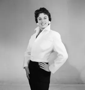 01187 Prints: Eunice Gayson, actress and model, poses in a jacket for Sunday Mirror Promotion