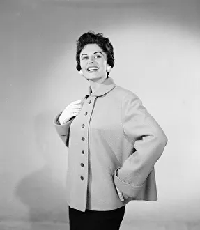 01187 Prints: Eunice Gayson, actress and model, poses in a jacket for Sunday Mirror Promotion