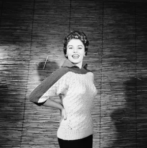 Sweater Prints: Eunice Gayson, actress and model, poses in a sweater for Sunday Mirror Promotion