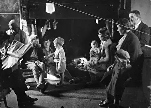 Hope Prints: Evacuation. The children happily play by the fireside with their new guardians in