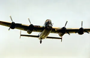 00587 Prints: EVALUATION SCAN ONLY. A Second World War Avro Lancaster bomber pictured leaving RAF