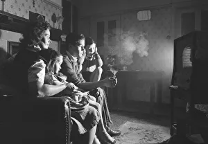 A evening in with the children, watching a coin-operated television