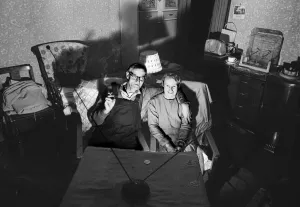 00099 Prints: A evening in for a husband and wife watching a coin-operated television