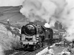 Evening Star, the last British rail steam locomotive to be built in Britain pulls in to