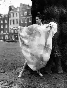 For evening wear Penny Carter models a Delarbi in silk with sunburst colours