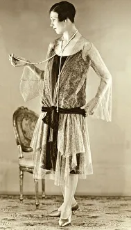 Chair Prints: Eveningwear circa 1925. Woman modelling the trends of 1926