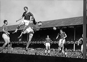 Images Dated 20th July 2021: Everton footballer Alex Young and Ipswich goalkeeper Hall go up for a corner kick