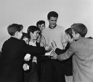 Everton footballer Brian Labone with schoolboy admirers after a round of golf at Bootle