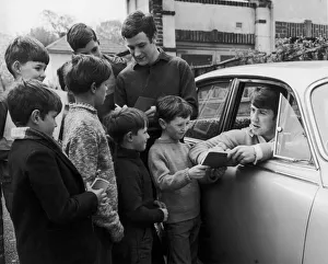 Boys Prints: Everton footballers Colin Harvey and Howard Kendall sign autographs for young fans