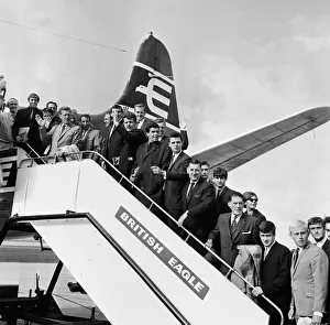 Plane Prints: Everton team members wave from their plane before departing Speke airport