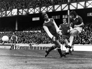 Everton v Arsenal. Telfer makes a good cross pat the lunging ex Everton skipper Alan Ball