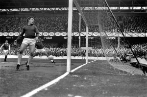 Everton v. Arsenal: West looks back in despair as Georgees shot goes past Hurstes foot to